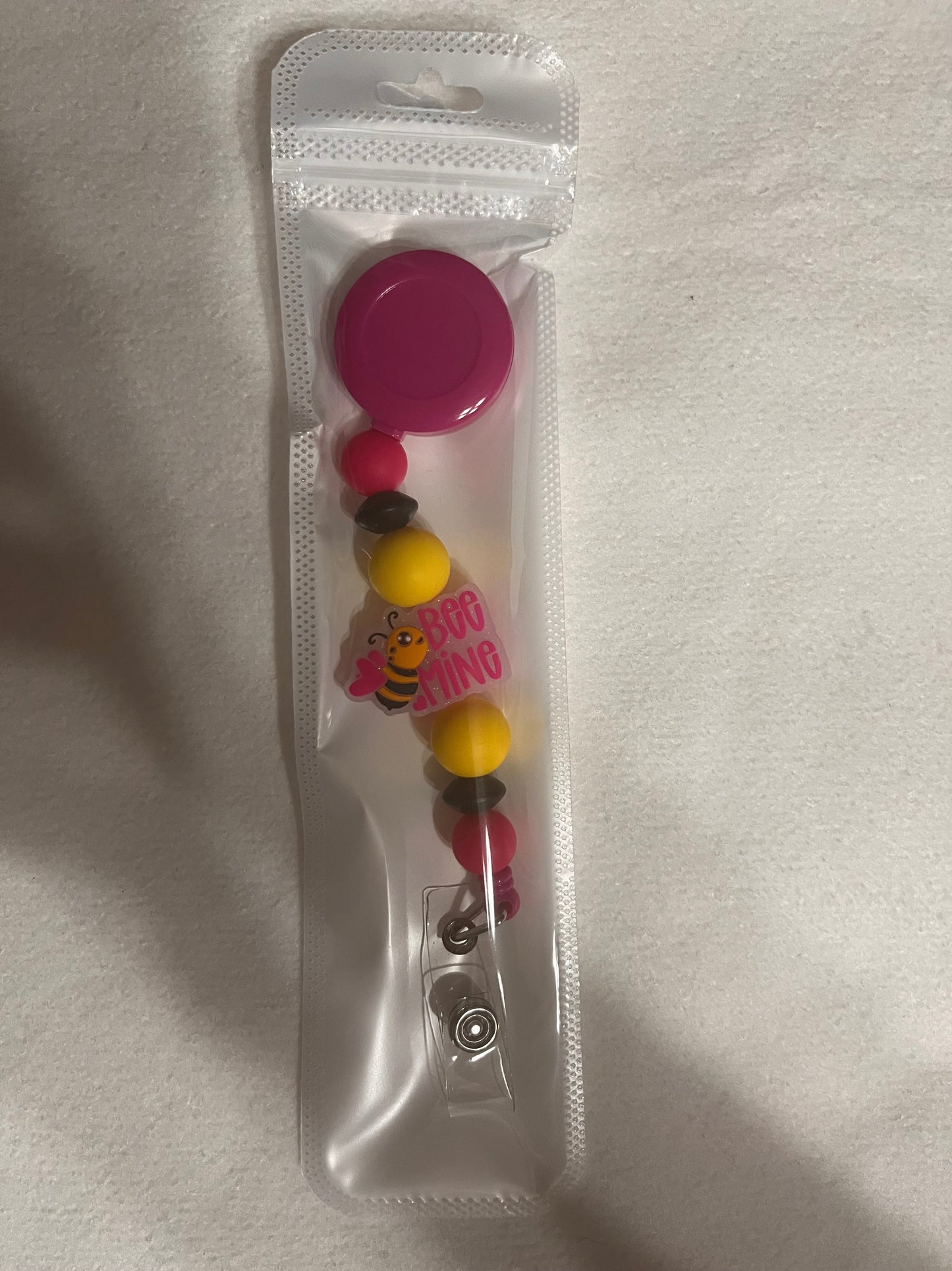 BEADED BADGE REELS