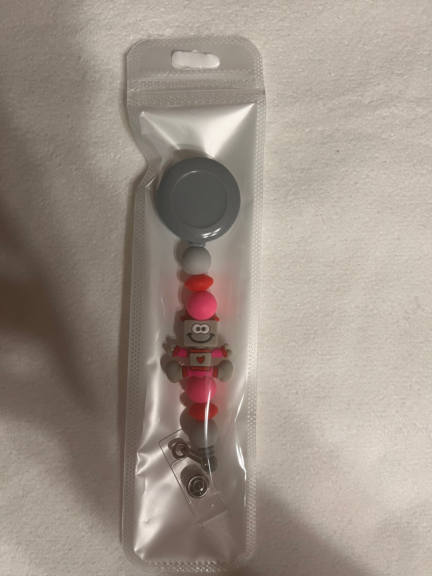 BEADED BADGE REELS